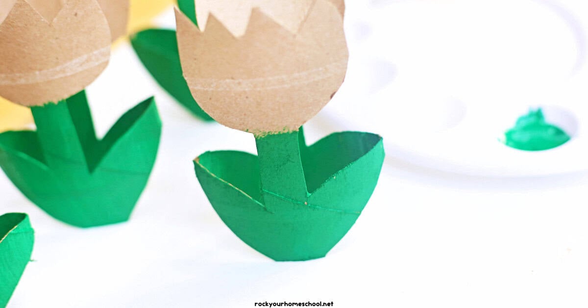 Example of toilet paper roll tulip with leaves and stem painted green.