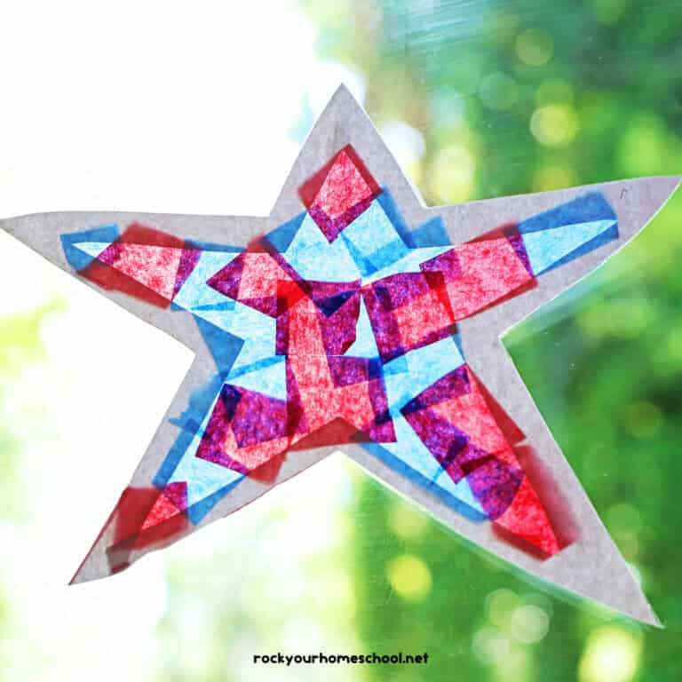 Example of patriotic suncatcher made with blue and red tissue paper, white cardstock, and clear contact paper.
