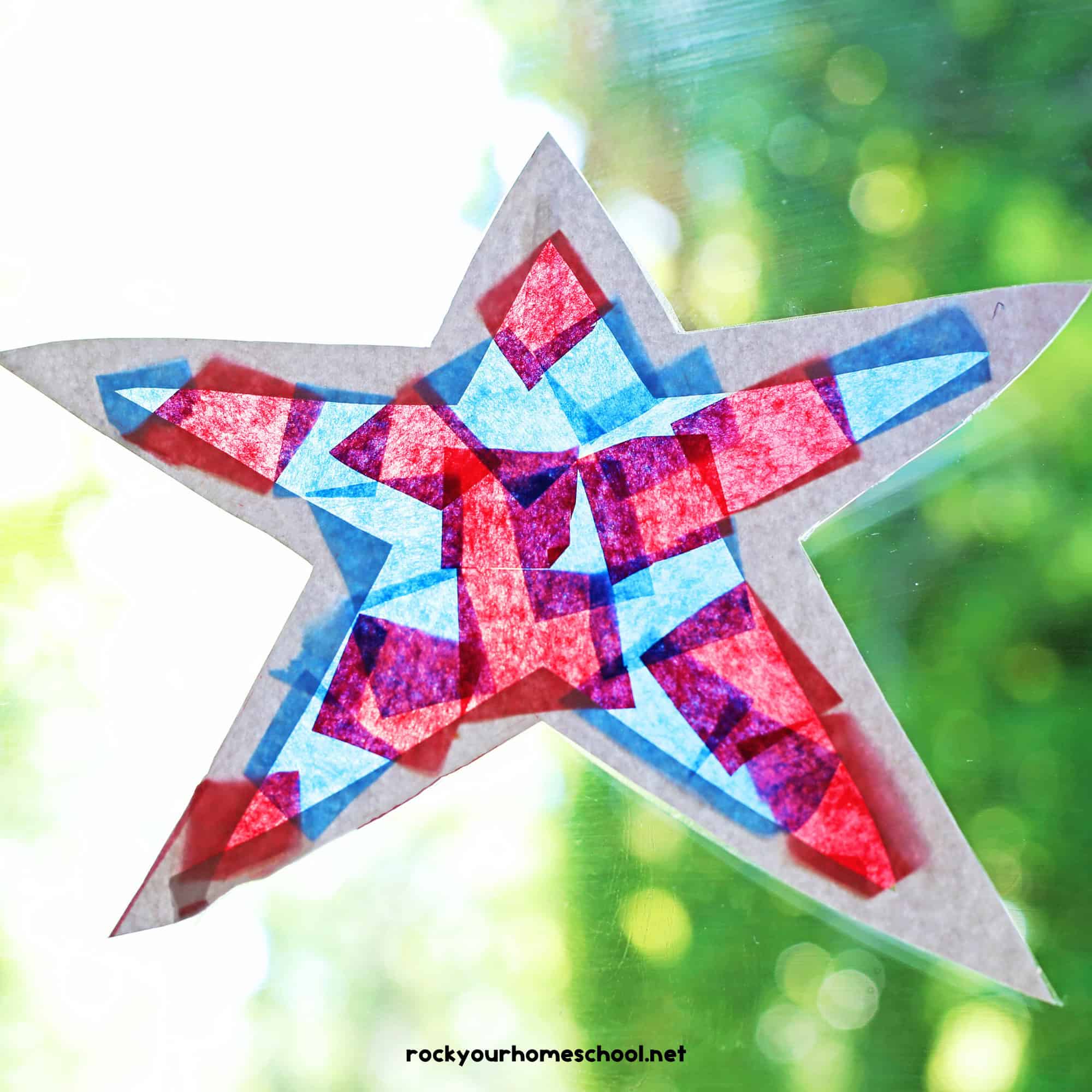 Example of patriotic suncatcher made with blue and red tissue paper, white cardstock, and clear contact paper.