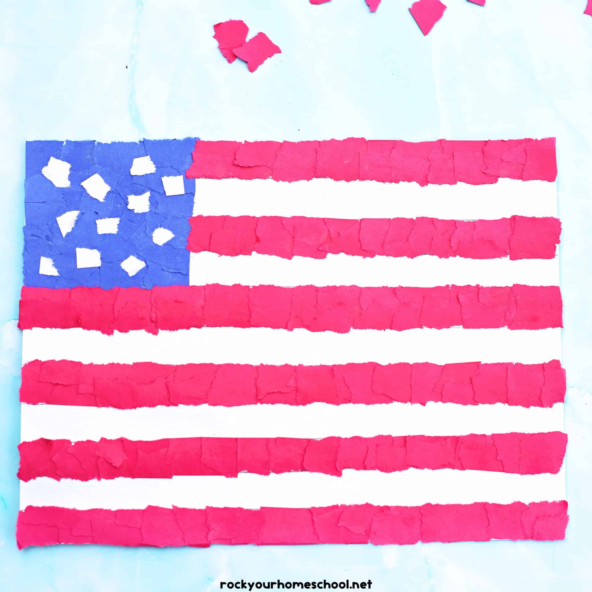 Example of torn paper American flag with blue, red, and white paper squares.