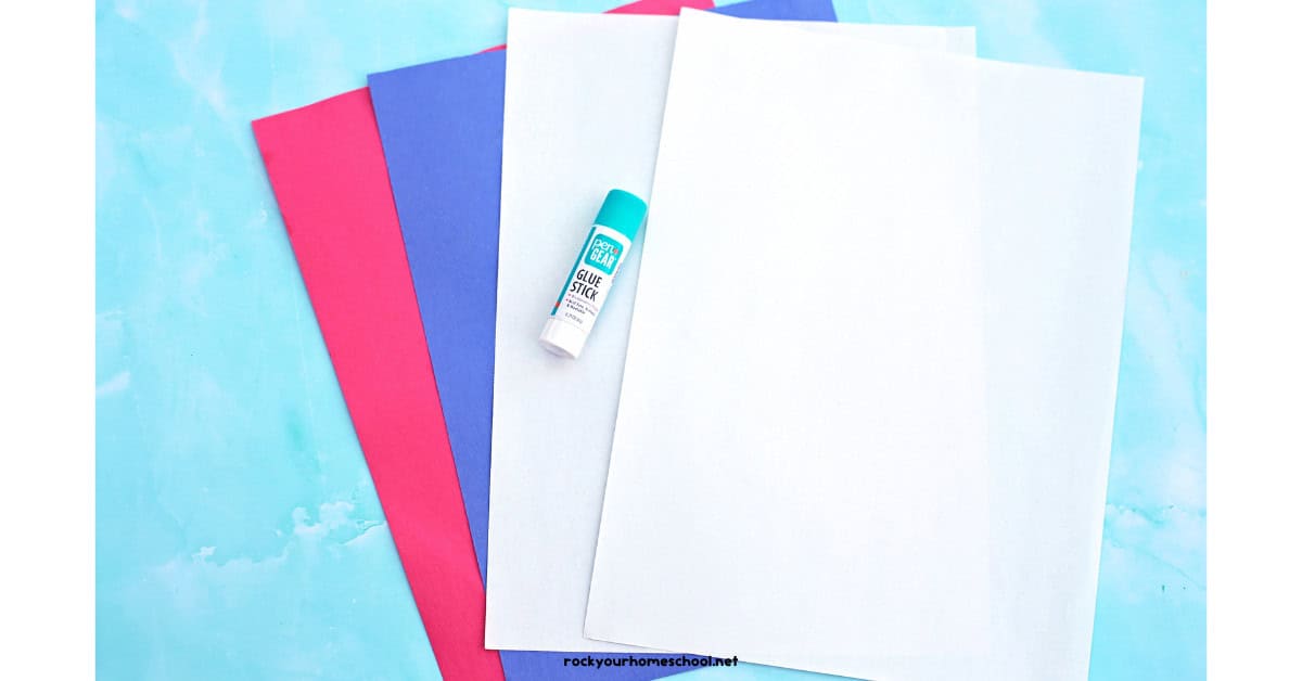 Red, blue, and white construction paper with glue stick.