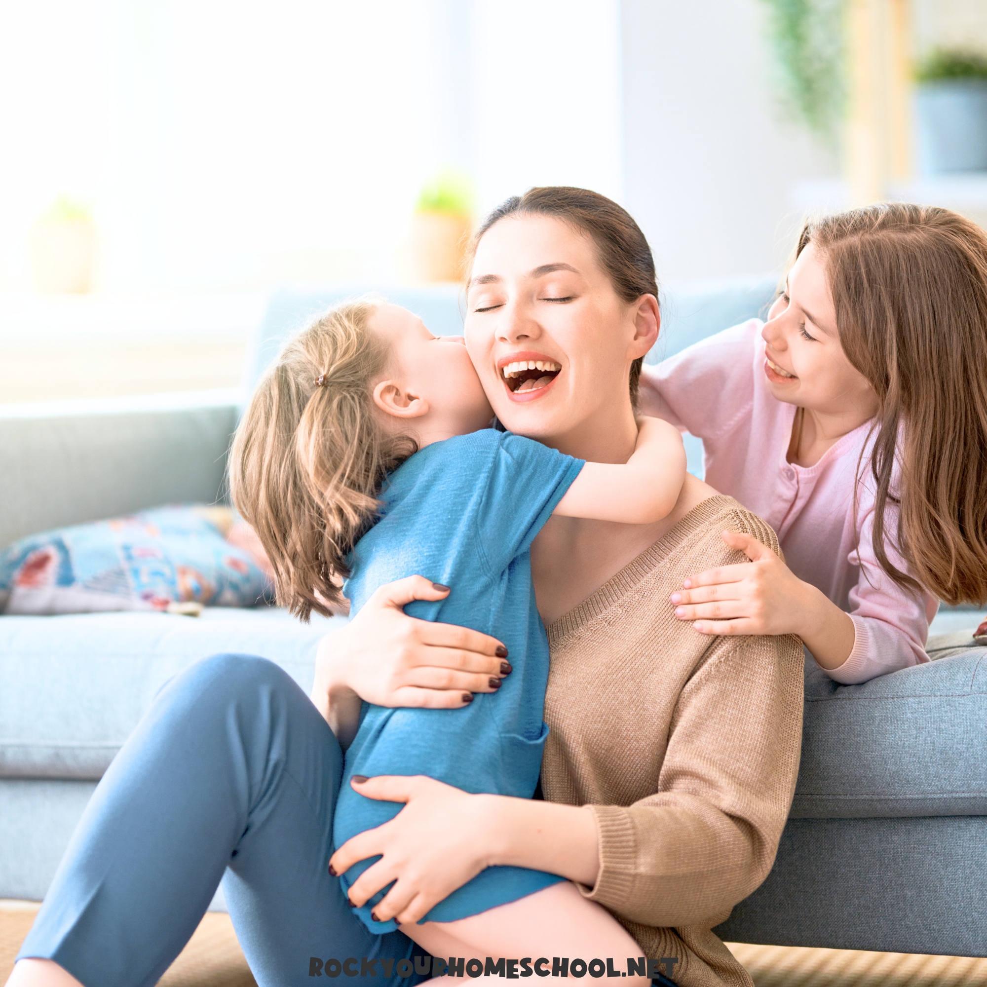 Mom with kids sitting on floor and smiling to feature Homeschool Morning Activities.