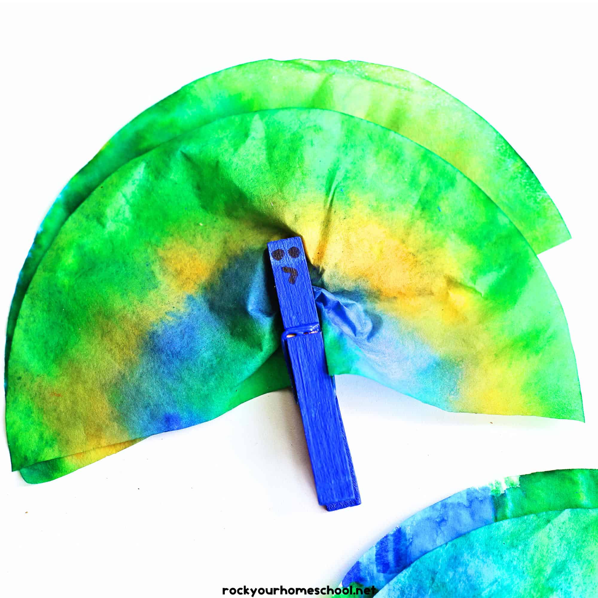 Example of coffee filter peacock with blue clothespin.