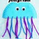 Example of light blue paper plate jellyfish with pipe cleaner tentacles and googly eyes.