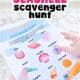 Personal holding free printable seashell scavenger hunt at the beach.