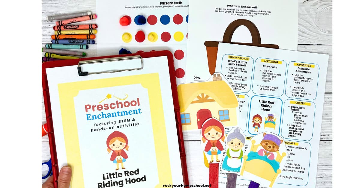 Woman holding red clipboard with example of free printable Little Red Riding Hood unit study from Preschool Enchantment and examples from the set.