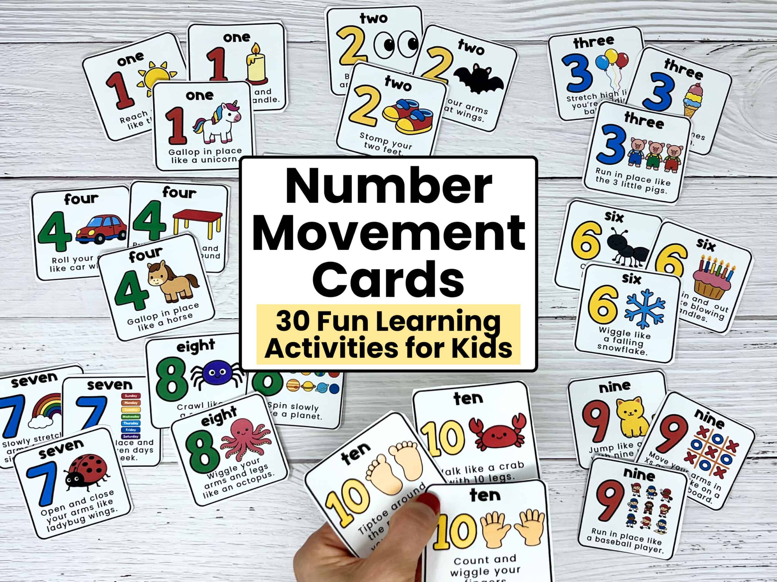 Woman holding examples of number 10 movement cards with fun prompts with the other cards from this printable set in the background.