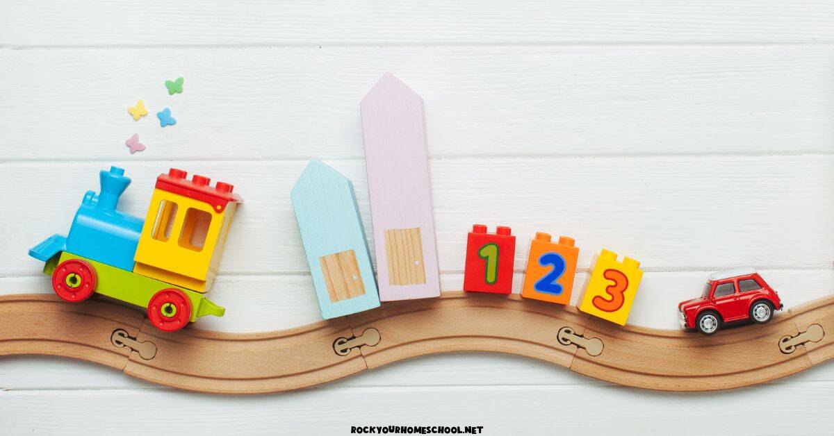 Wood train track with toy train, blocks, and car.