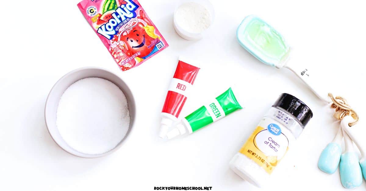 Kook-Aid watermelon packet, cup of flour, red and green food coloring, cream of tartar, measuring spoons.