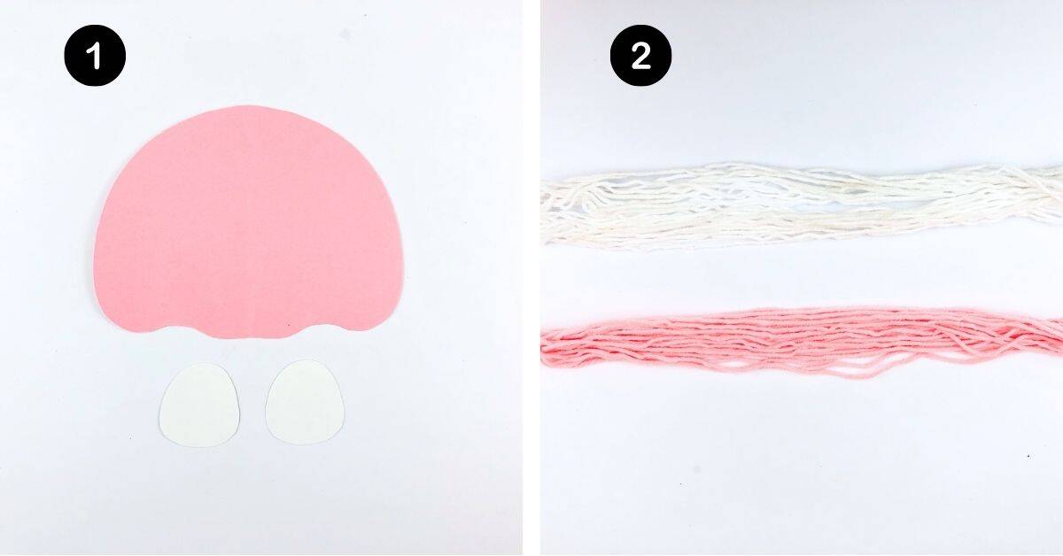 Pink paper cut into jellyfish body and two white paper pieces for eyes with white and pink yarn.