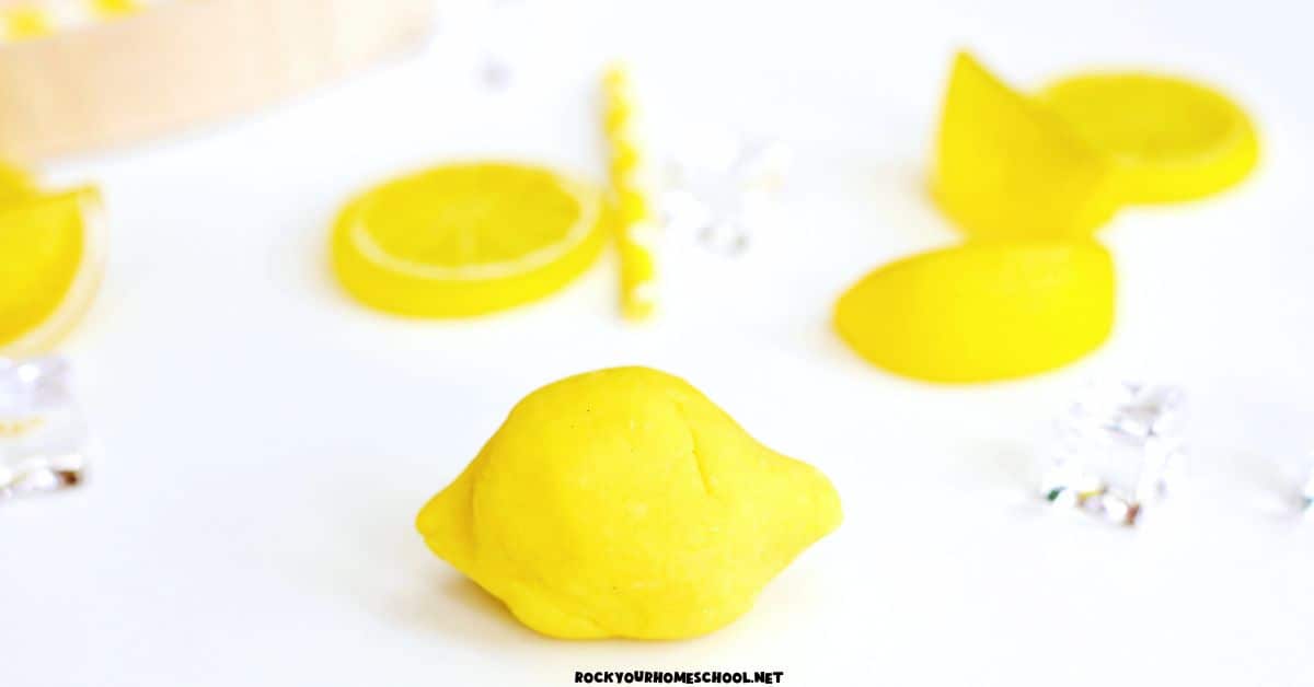 Bright lemon playdough in shape of lemon.