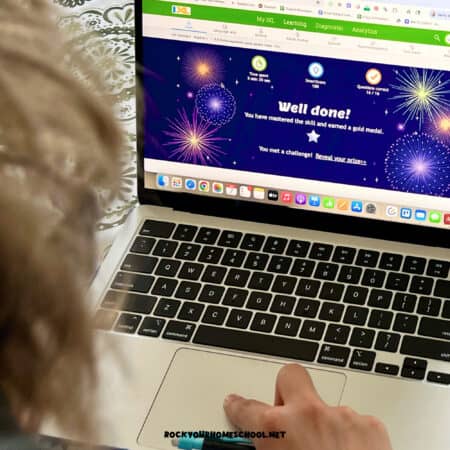 Teenage boy using laptop for IXL, a comprehensive K-12 online homeschool program.