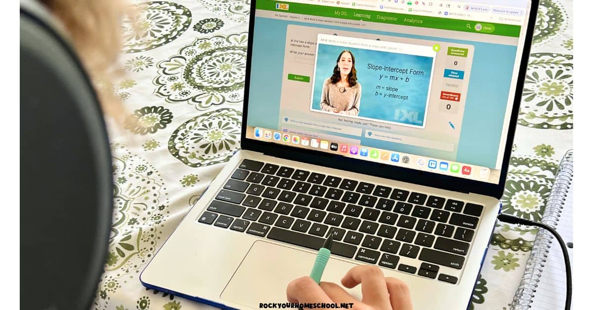 Teenage boy using laptop to watch Algebra lesson on IXL.
