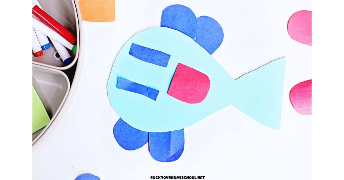 Silly paper fish craft with smiley face.