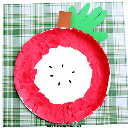 Example of torn paper apple craft made with paper plate and handprint stem.