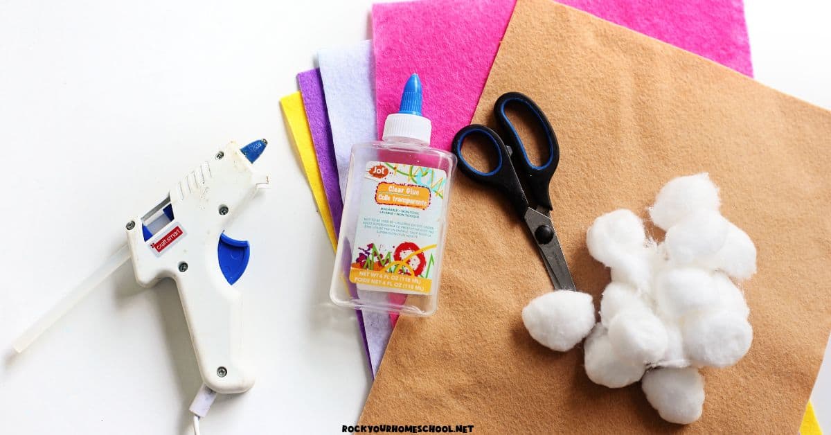 Felt squares, cotton balls, scissors, glue, and hot glue gun.