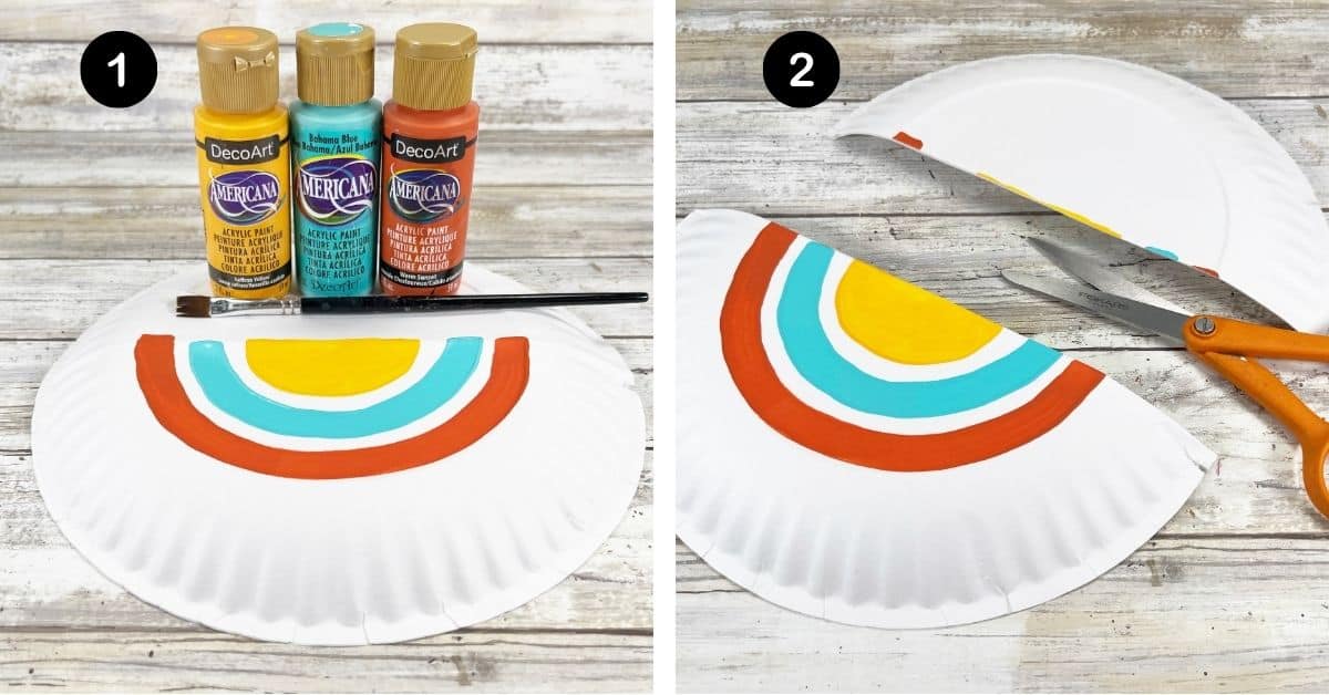 Paper plate with yellow, light blue, and orange paint with paint brush and scissors to cut the plate in half.