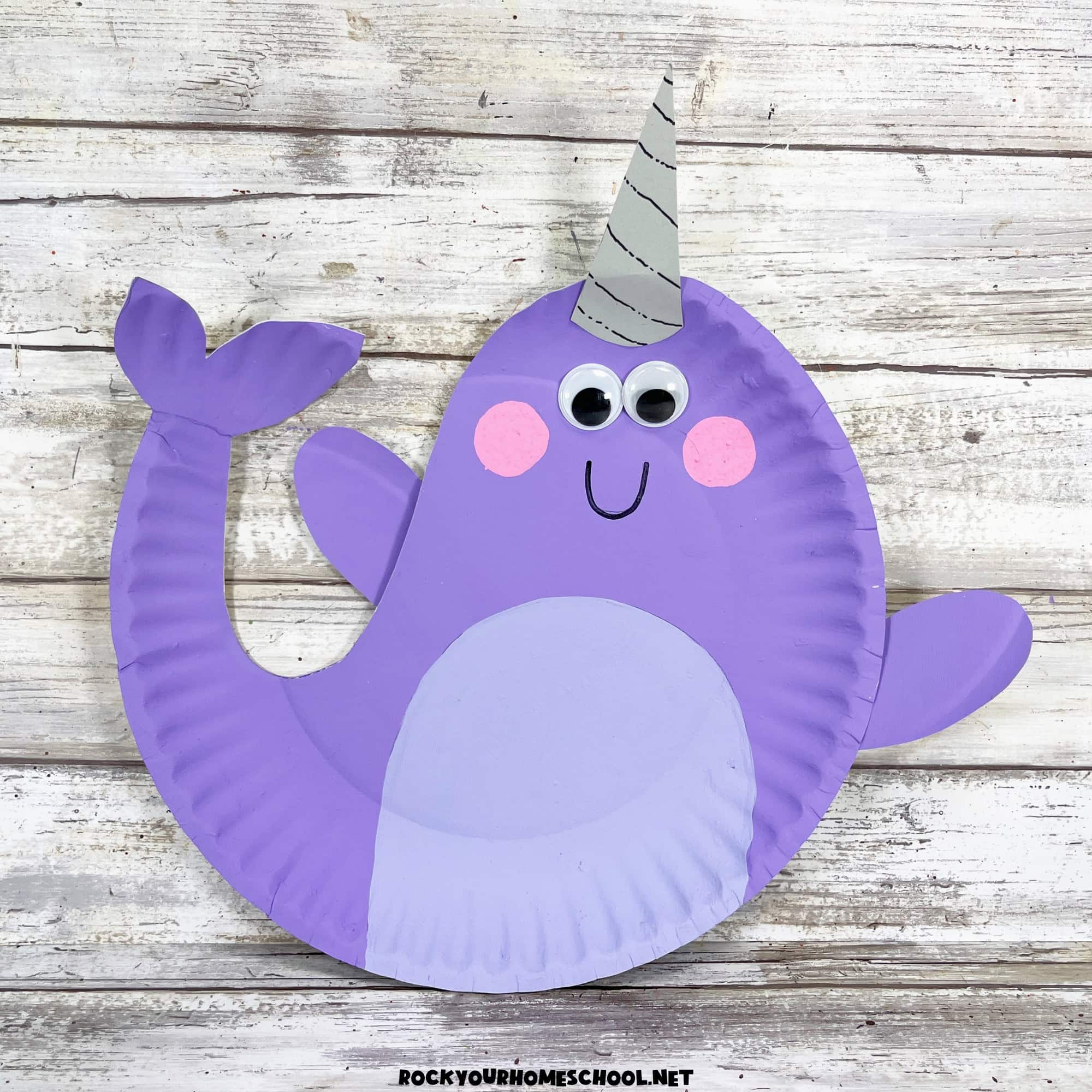 Example of cute purple paper plate narwhal craft for kids with free printable template.