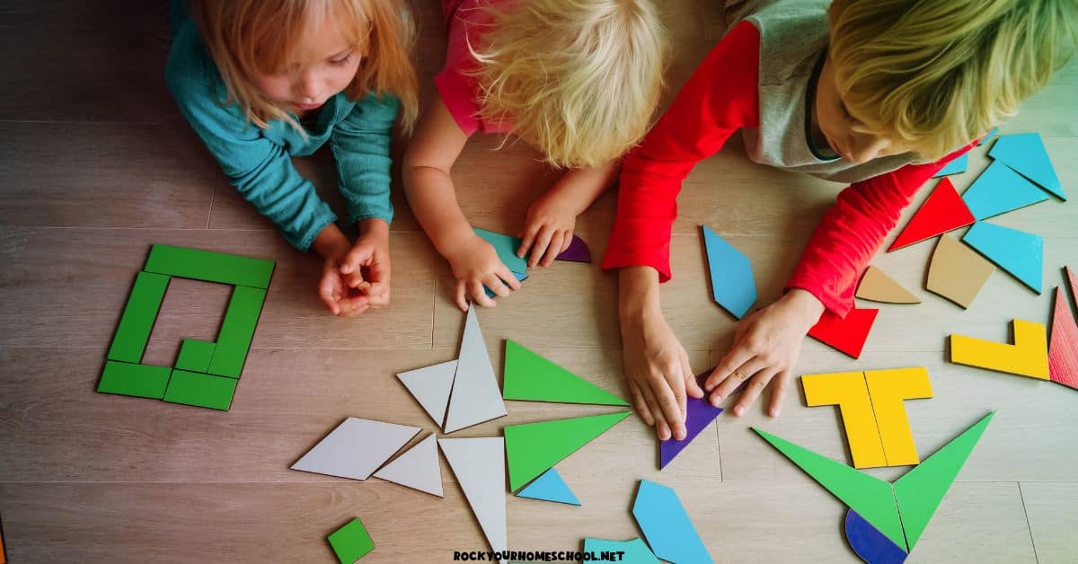 Children playing with tangram puzzle pieces of floor for What is Quiet Time for Kids?