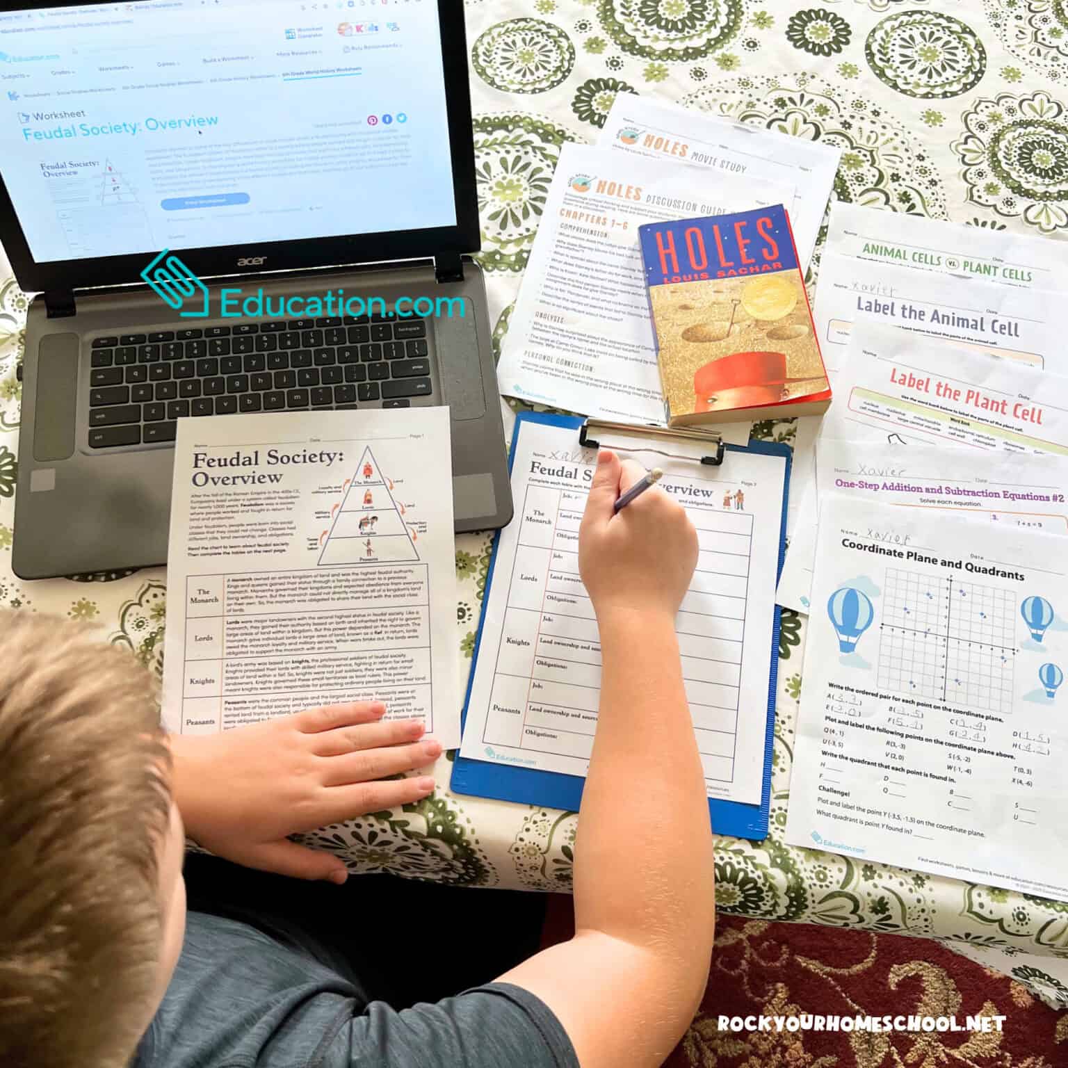 Middle school boy working on 6th grade worksheets from Education.com for social studies, reading, math, and science.