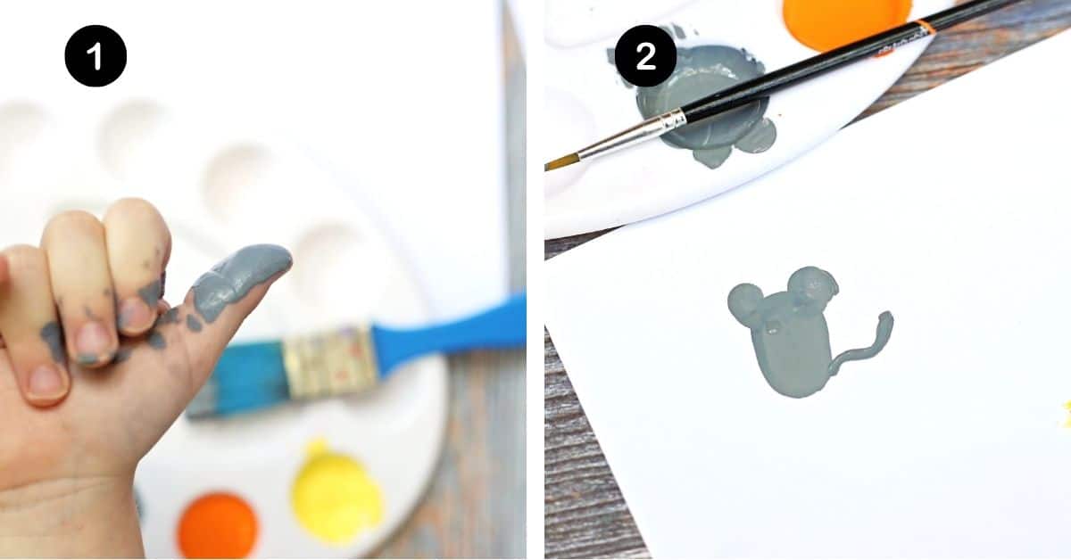 Gray paint on child's thumb and thumbprint mouse.
