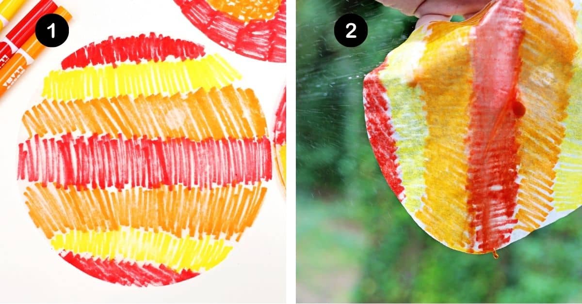 Coffee filter colored with red, yellow, and orange markers and person spraying it with water.