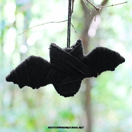Example of easy bat craft for kids that uses black yarn and free printable template.