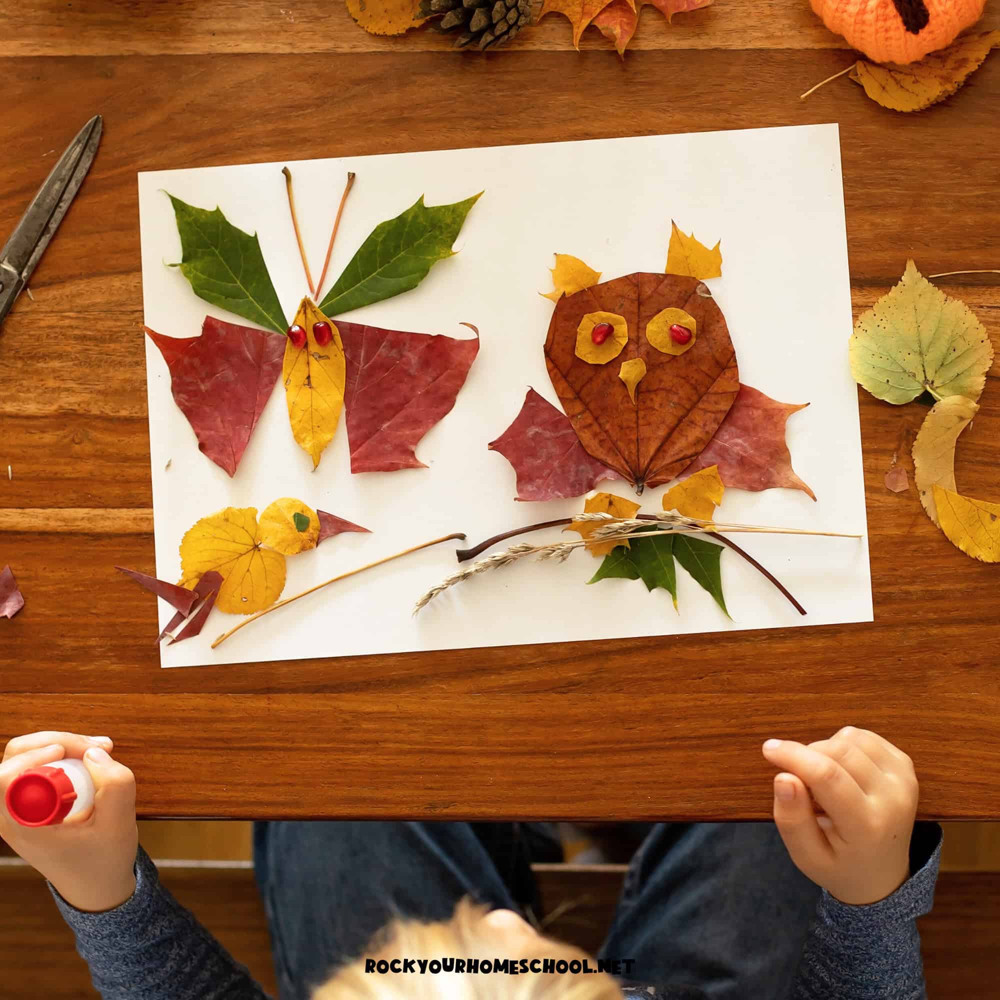 Child holding glue stick and making leaf art of owl, duck, and butterfly.
