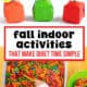 Paper craft pumpkin and apples with child working in sensory box with different colors of pasta for fall indoor activities.