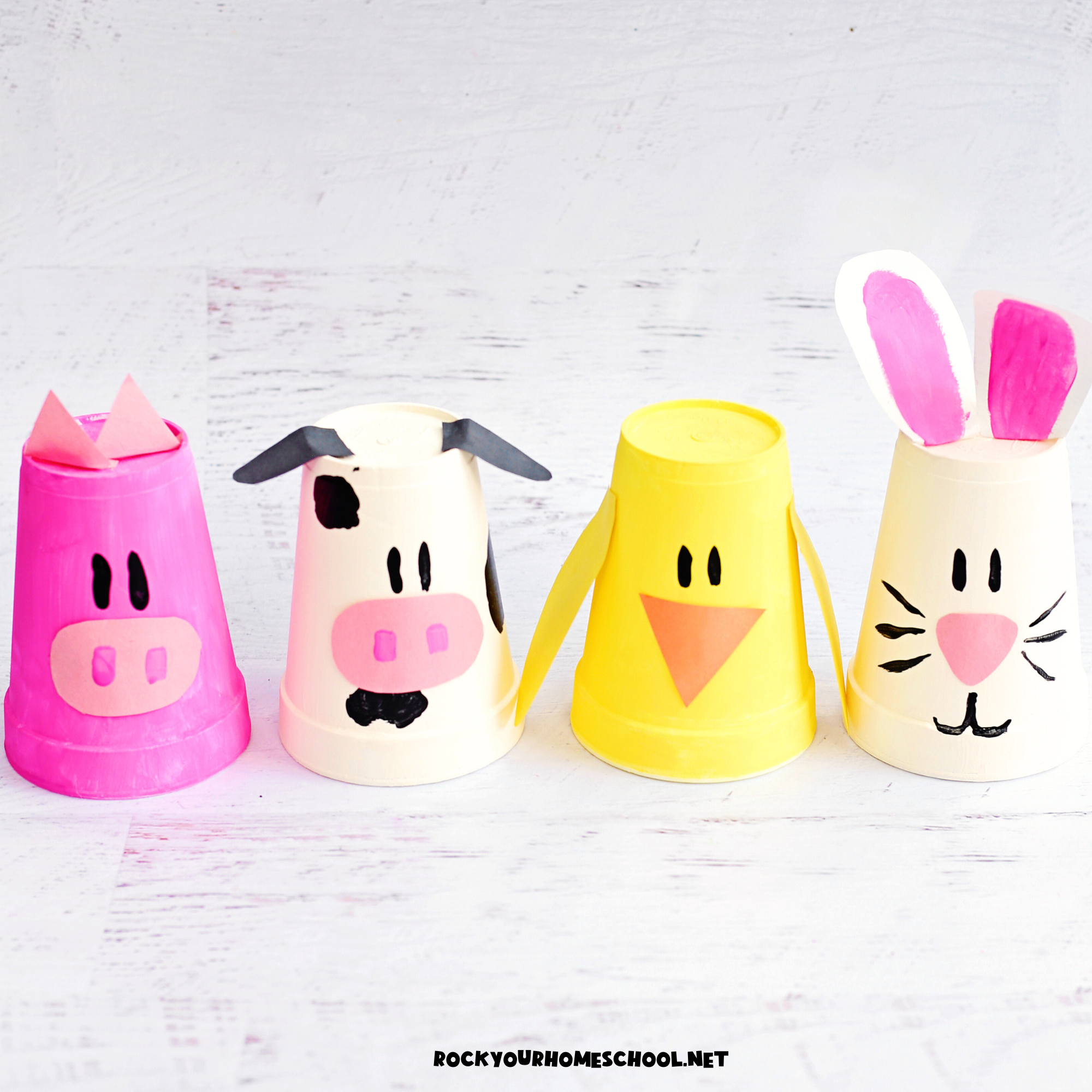 Examples of paper cup animals featuring pig, cow, chick, and bunny.
