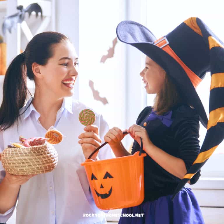 Smiling mom and daughter in Halloween costume to feature these stress-free Halloween fun ideas, activities, and printables for kids.