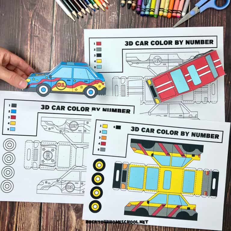 Woman holding examples of 3D paper car crafts with examples of printable templates.