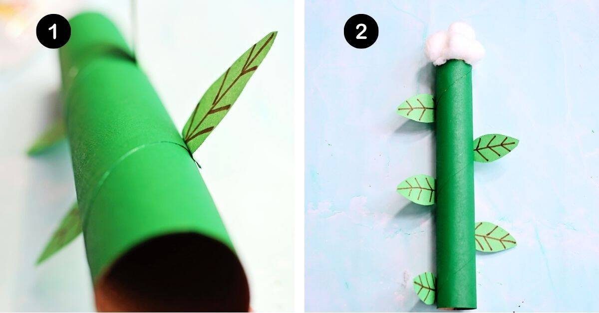 Green paper towel tube with green paper leaves and cotton balls on top.
