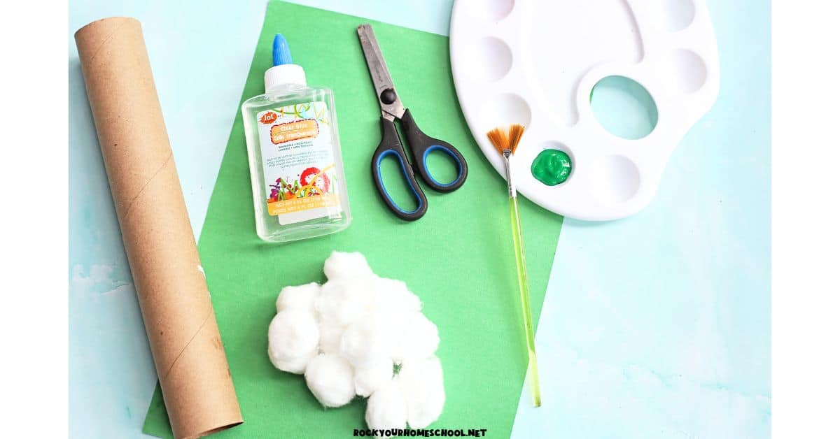 Green construction paper, paper towel roll, cotton balls, clear glue, scissors, and green paint with paint brush.