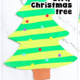 Example of paper strip Christmas tree in greens with brown trunk, colorful paper ornaments, and yellow star.