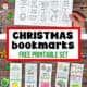 Woman holding page of printable Christmas bookmarks to color with five examples.