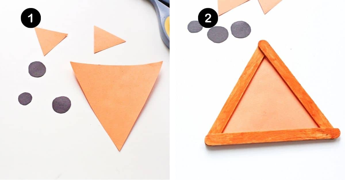 Orange paper cut into triangles and black paper cut into circles and orange popsicle sticks glued into triangle shape.