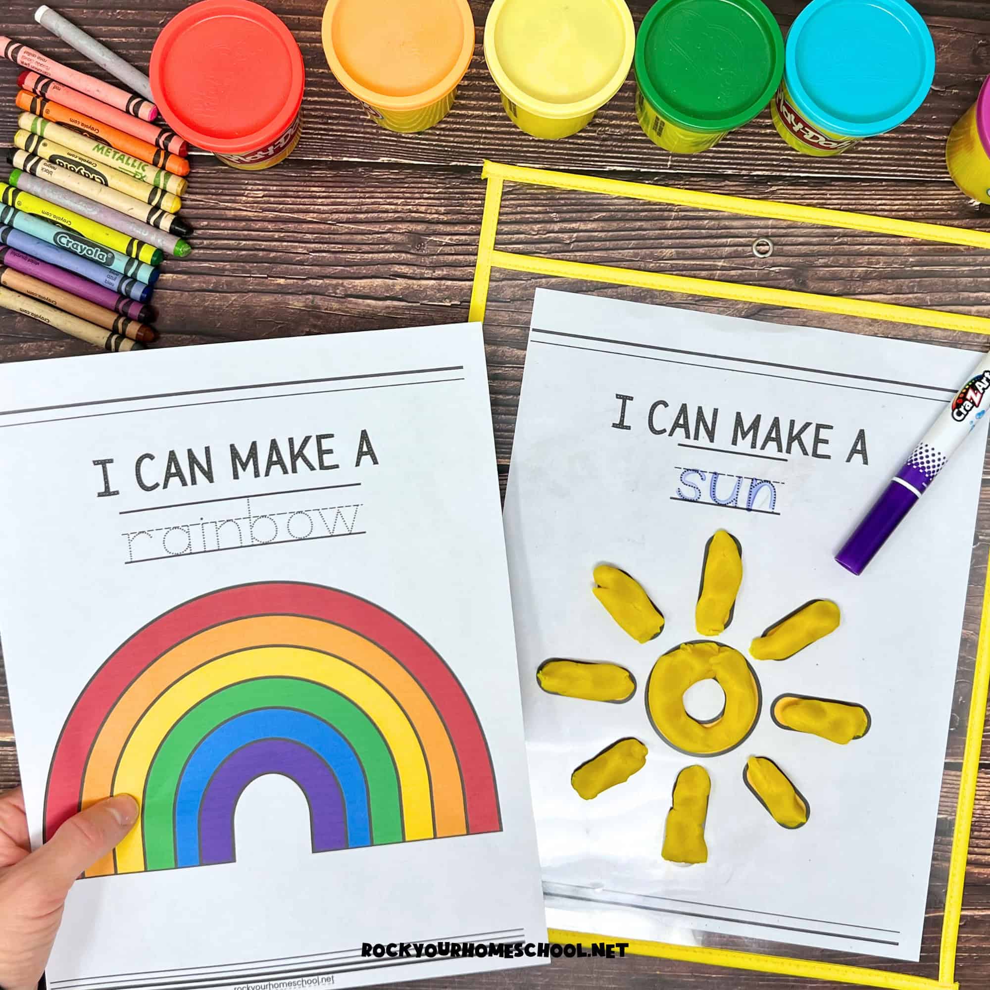 Woman holding examples of free printable weather playdough mats with rainbow and sun.
