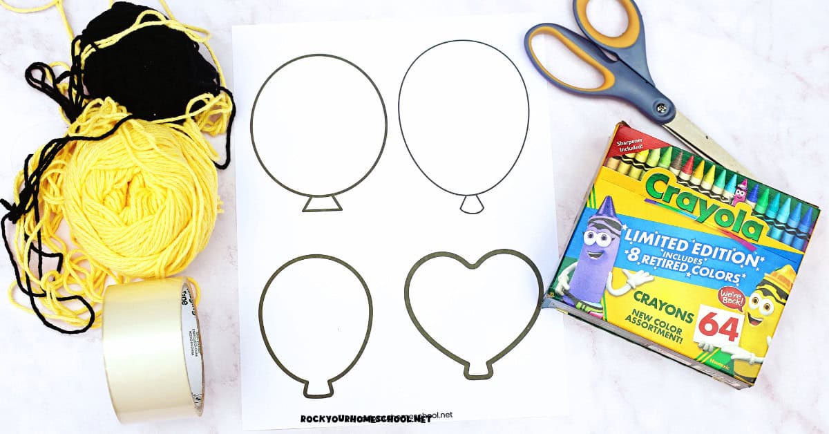 Free printable paper balloons template, yarn, tape, scissors, and crayons.