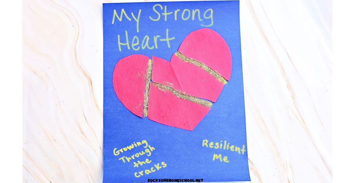 Example of resilience craft for kids that features a Kintsugi-inspired activity with torn paper heart and gold glitter.