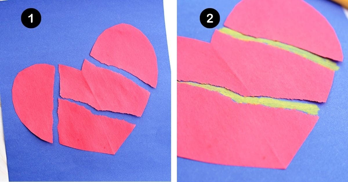 Red paper heart torn into pieces on blue construction paper with yellow marker in the cracks.