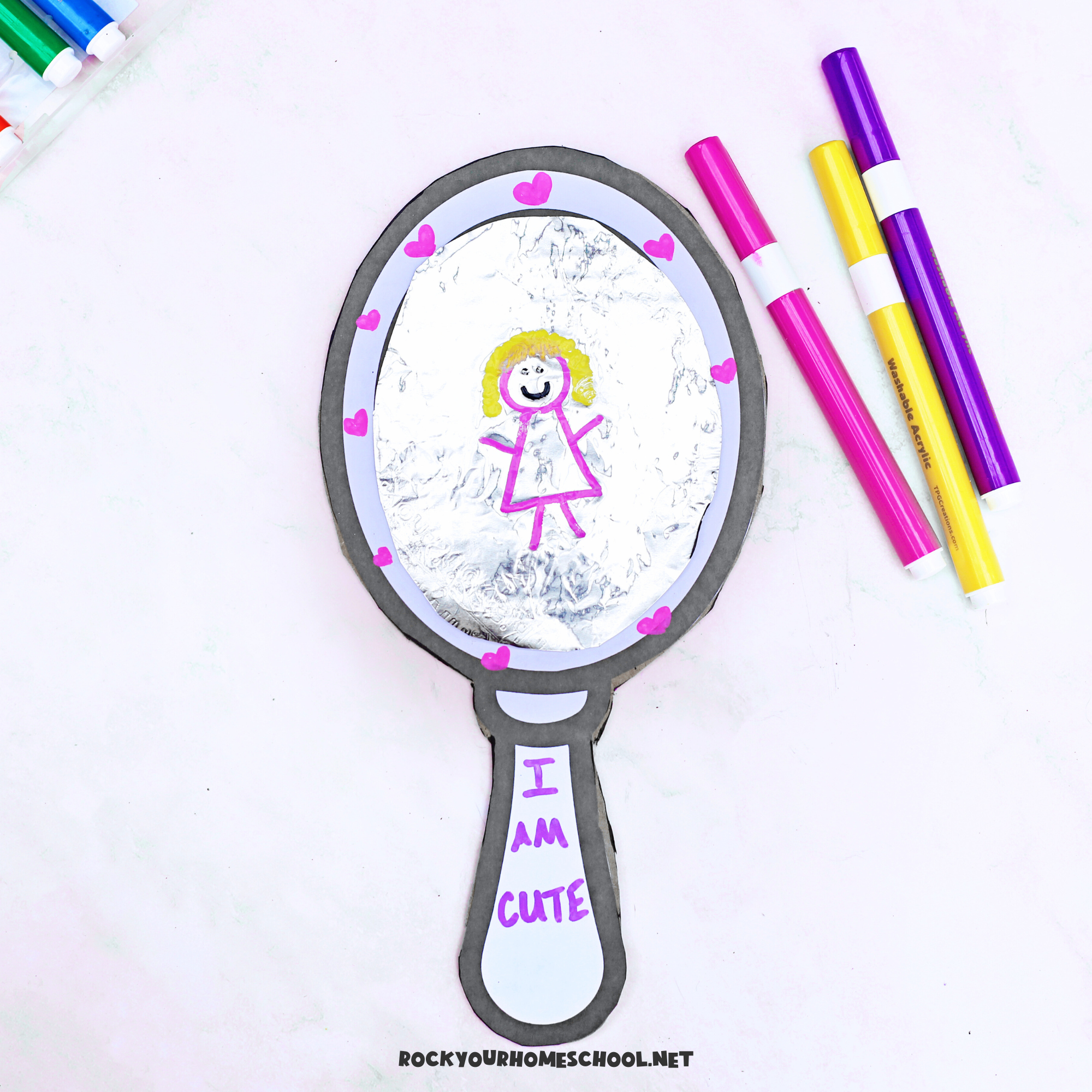 Self-esteem craft for kids that features a simple mirror made out of cardboard and aluminum foil with free printable template.