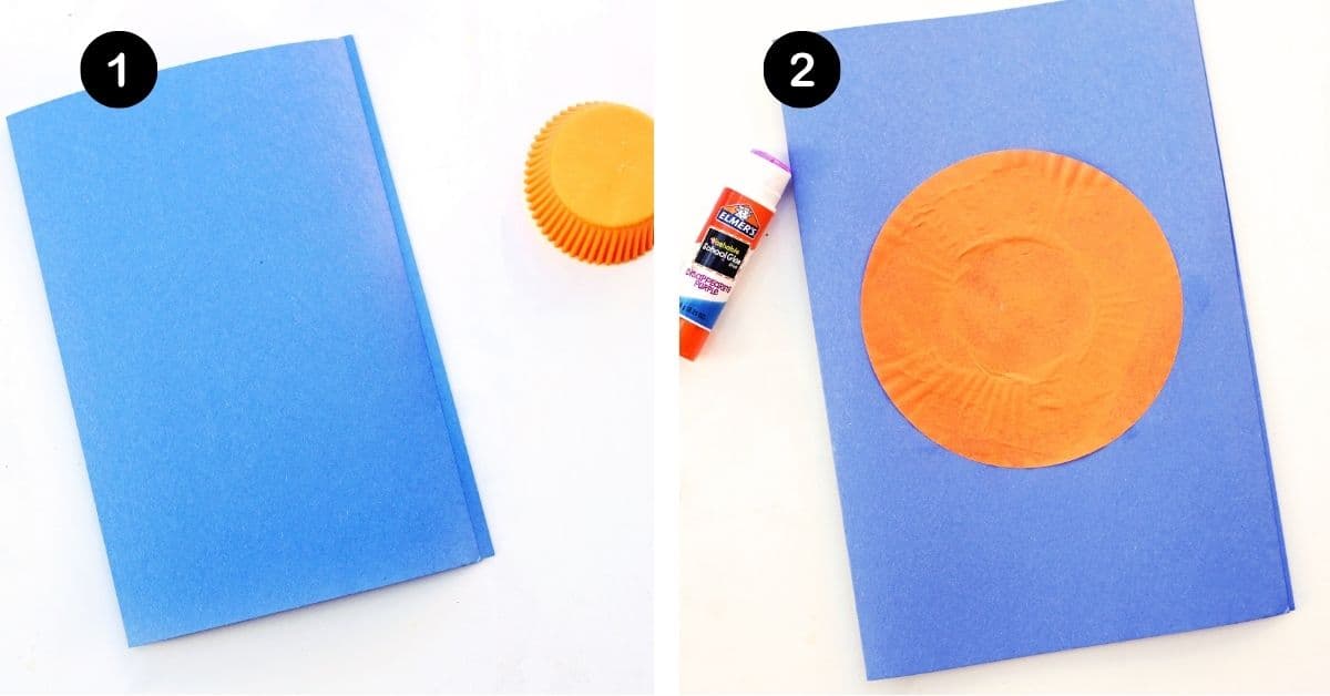 Folded pieces of blue construction paper with flat orange cupcake liner and glue stick.