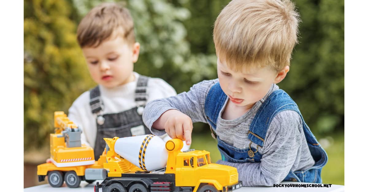 Two young boys playing with trucks to feature this transportation preschool summer theme.