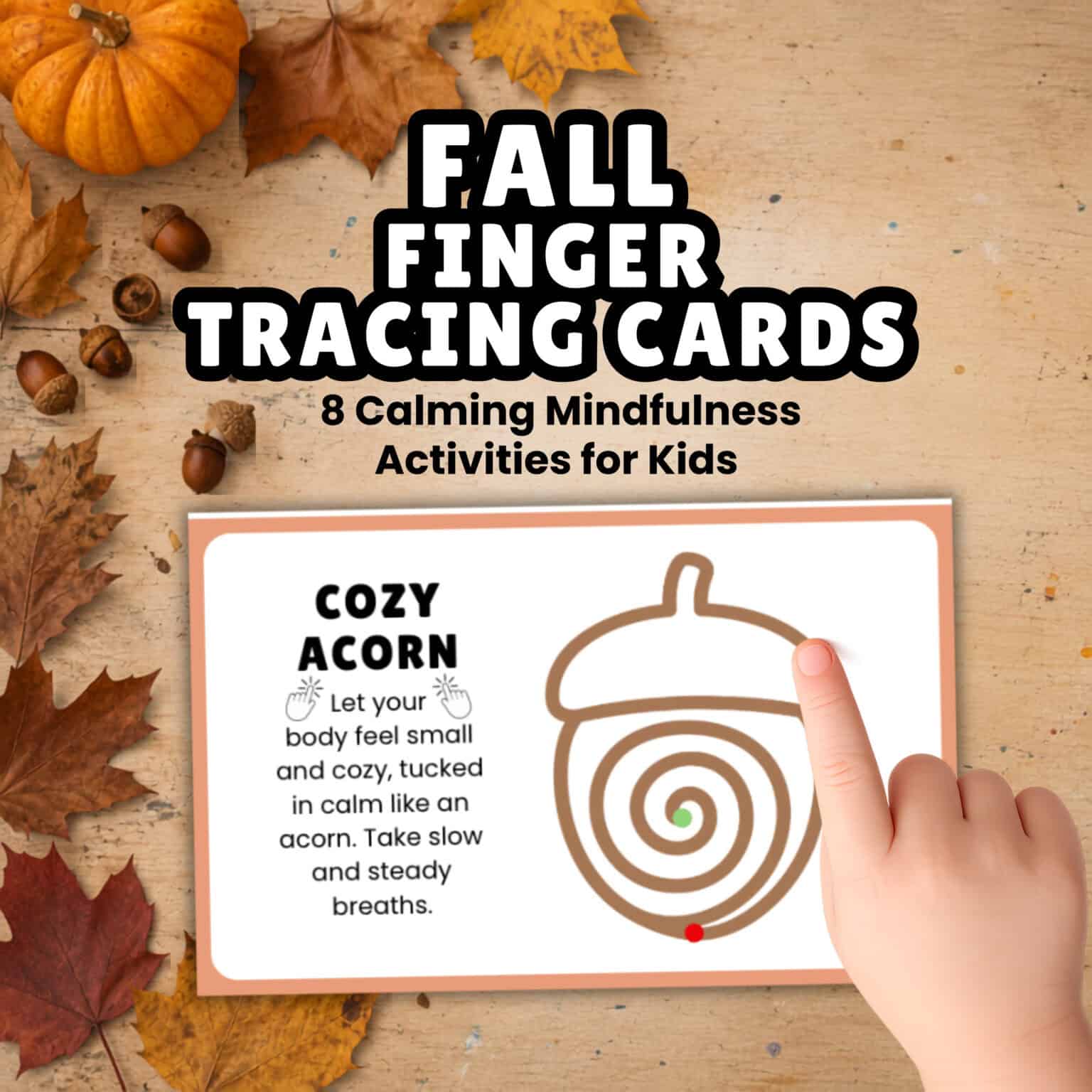 A child's finger tracing an acorn shape on a fall finger tracing card.
