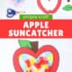 Free printable template, pile of colorful pieces of tissue paper, and apple suncatcher craft for kids.