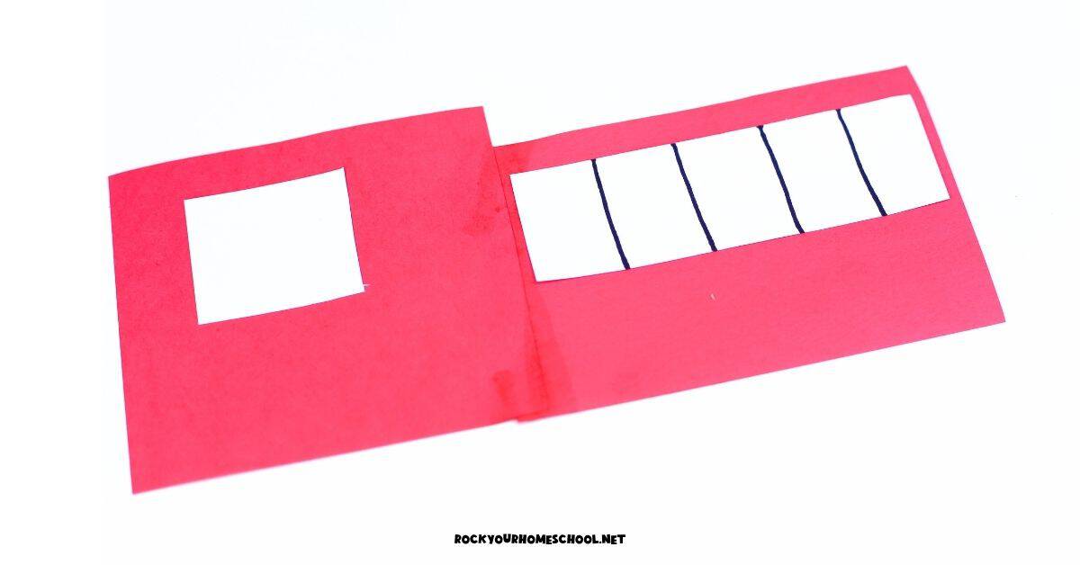 White square and rectangle with black lines on red paper shapes for fire truck craft step 2.