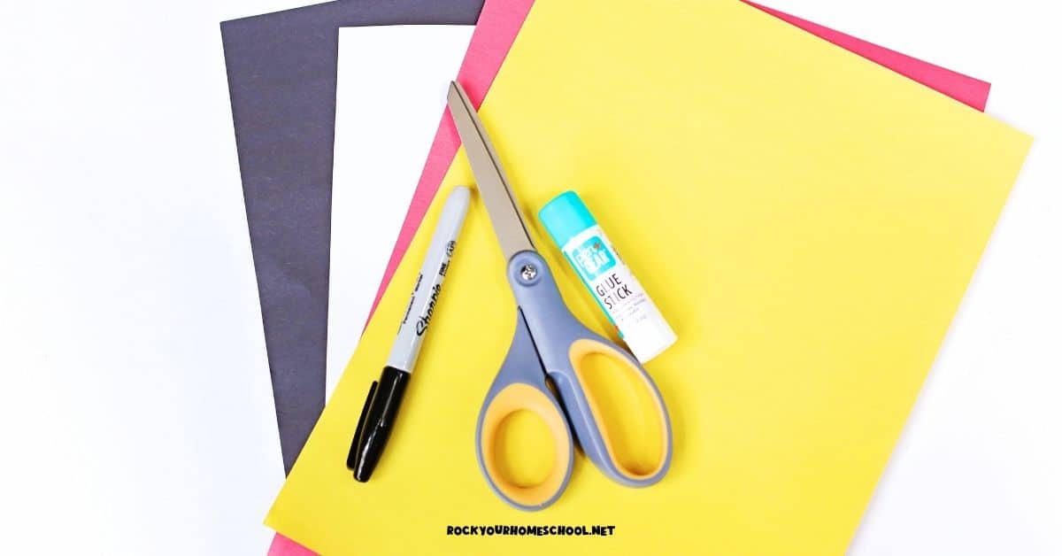 Construction paper in black, white, red, and yellow with black marker, scissors, and glue stick to make this fire truck craft for kids.